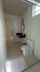 a bathroom with a glass shower and a toilet at Villa Hotel in Bom Jesus da Lapa +39 photos