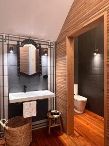a bathroom with a sink and a toilet at Hommage in Horta +90 photos