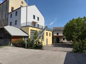 an empty parking lot in front of a building at Loft zum alten Kraftwerk in Herzogenburg