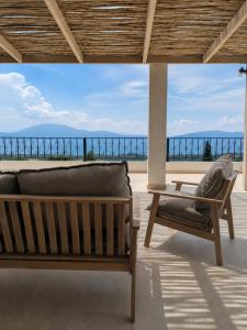 a living room with a couch and a table at Trigono Suites - Primavera 