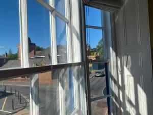 an open window with a view of a street at Spa View Apartments in Ripon