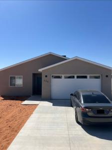 a car parked in front of a garage at The Sand and Sage Suite in Page