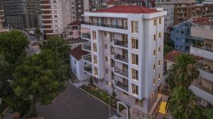 an overhead view of a white building in a city at VELIERO Residence by Bracera in Lugovi +49 photos