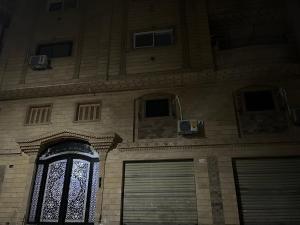 a building with a door and a window at Your sweet house in Minshāt Şabrī