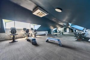 a gym with several treadmills and exercise equipment at Cotswolds Apartment 1, sleeps 4 in Chipping Norton