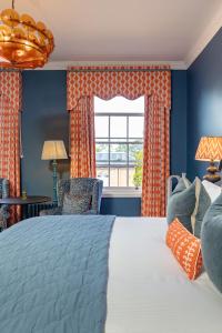 a bedroom with a large bed and a window at Ansty Hall in Coventry