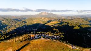 an aerial view of a mountain with a train at Refúgio Tapera Bungalows & Wellness in Venda Nova do Imigrante
