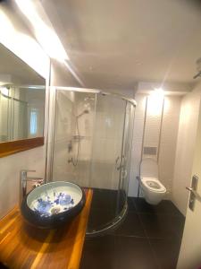 a bathroom with a glass shower and a toilet at R S CİTY HoTEL in Samsun +39 photos