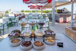a buffet of food on a table on a patio at Villa Coo Boutique Hotel - Adults Only in Kos
