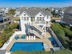 an aerial view of a house with a swimming pool at Sandcastle in Corolla