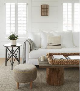 a living room with a white couch and a table at The Inn at GrayBarns in Norwalk