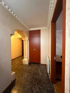 an empty hallway of a building with a room at flat in Itʼkhvisi