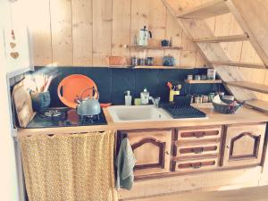 a kitchen with a sink and a counter top at Espace Bulle-Zen in Burlats