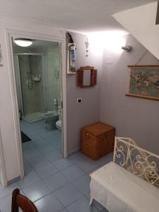 a bathroom with a shower and a toilet and a sink at Casa Ida in Montemarcello +47 photos