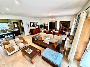 a living room with a couch and a table at Villa Bessa Nature & Spa in Fafe