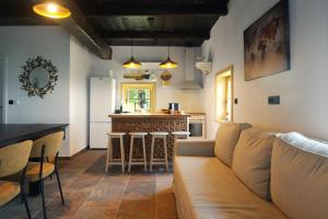 a living room with a couch and a kitchen at Lady Wine in Plešivica