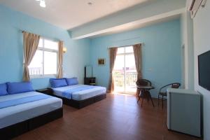 Postelja oz. postelje v sobi nastanitve Wu Li Ting B&B