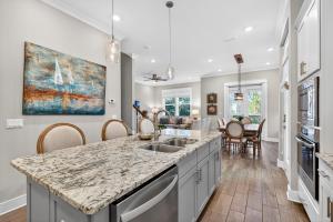 a kitchen with a sink and a counter top at Mystic Seas in Watersound Beach