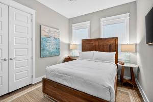 a bedroom with a bed and two windows at Mystic Seas in Watersound Beach +30 photos