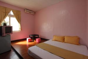 Postelja oz. postelje v sobi nastanitve Wu Li Ting B&B