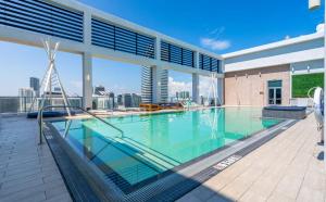 a swimming pool on the roof of a building at CD1608 Downtown Loft with Pool a Gym and City Views in Miami in Miami