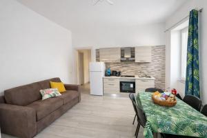 a living room with a couch and a table at Casa Concettina in Ercolano