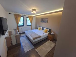 a small bedroom with a bed and a window at Vila Rakovica Ilidža Sarajevo in Sarajevo
