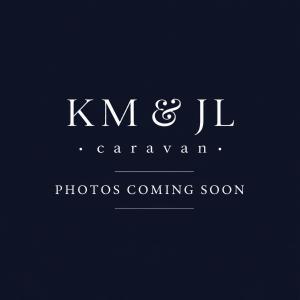 a logo for a photography company with a black background at KM & JL Caravan in Cresswell
