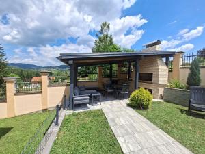 a gazebo in a yard with a patio at Vila Rakovica Ilidža Sarajevo in Sarajevo