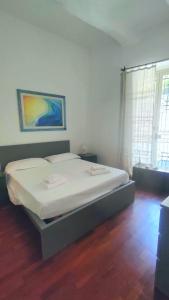 a bedroom with a bed in a room at Casa Angioletta in Taormina