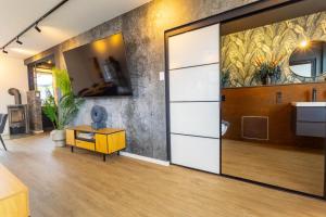 a living room with a large sliding door at Kleine Austernperle in Dornumersiel