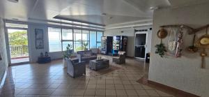 a large living room with a couch and a table at Oceanfront 3-bedroom Sub-Penthouse in Luquillo PR in Luquillo