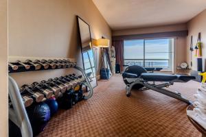 a hotel room with a gym with a large window at Enjoy Punta del Este in Punta del Este