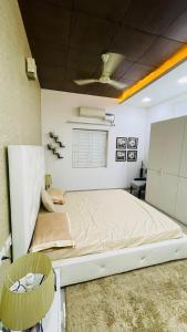 a bedroom with a large bed in a room at Blue Breeze Villa in Mahabalipuram
