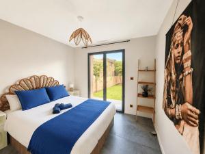 a bedroom with a large bed and a large window at Villa Mezzanotte Le Brusc 80m de la mer - Climatisation-Piscine-Parking in Six-Fours-les-Plages +19 photos