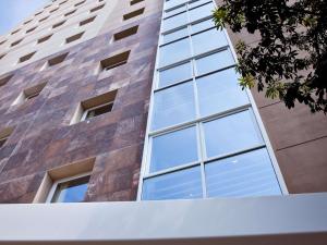 a tall building with windows on the side of it at ibis Lima Larco Miraflores in Lima