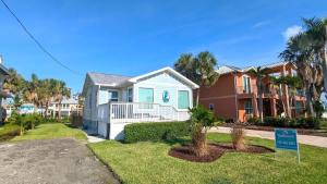 a house with a sign in front of it at 213 Ohio in Fort Myers Beach +24 photos