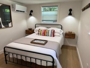 a bedroom with a bed with a tray on it at Sunapee Getaway With Lake Access in Sunapee