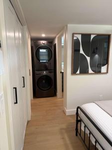 a laundry room with a washer and dryer in a room at Sunapee Getaway With Lake Access in Sunapee