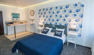 Ліжко або ліжка в номері Central Hotel