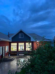 a house with a bench in front of it at Archa Ethno Guest House in Bokonbayevo