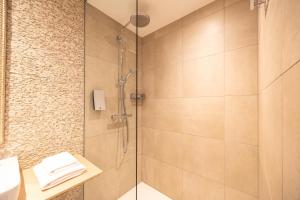 a shower with a glass door in a bathroom at Berliner Hof Bed&Bike in Saint-Vith +19 photos