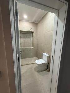 a bathroom with a toilet and a shower at Casa Vila de Frades in Vila de Frades +14 photos
