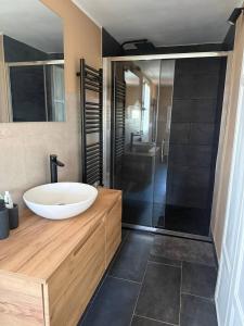 a bathroom with a sink and a tub and a shower at Villa Gopal Natura Toscana vicino Lucca 7 posti in Capannori +18 photos