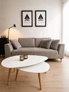 a living room with a couch and a white coffee table at Apartmán Hestia 5 in Rajecké Teplice