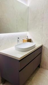 a bathroom with a sink and a mirror at Lanas place in Ljubljana +14 photos