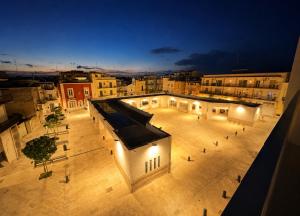 an aerial view of a building at night at Domus Regina Sforza in Capurso