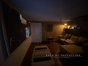 a dark living room with a couch and a table at Galerie Guanajuato Centro in Guanajuato