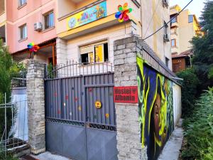 a house with a gate in front of it at Villa Villekulla in Tirana