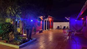 a house with purple and blue lights on a patio at Vila Santê in Belo Horizonte +16 photos